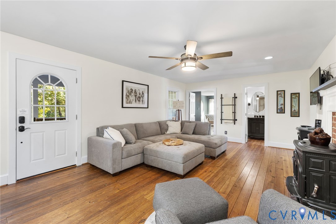 6256 Old Buckingham Road Powhatan, VA 23139 - Photo 17 of 48 a living room with furniture and a wooden floor