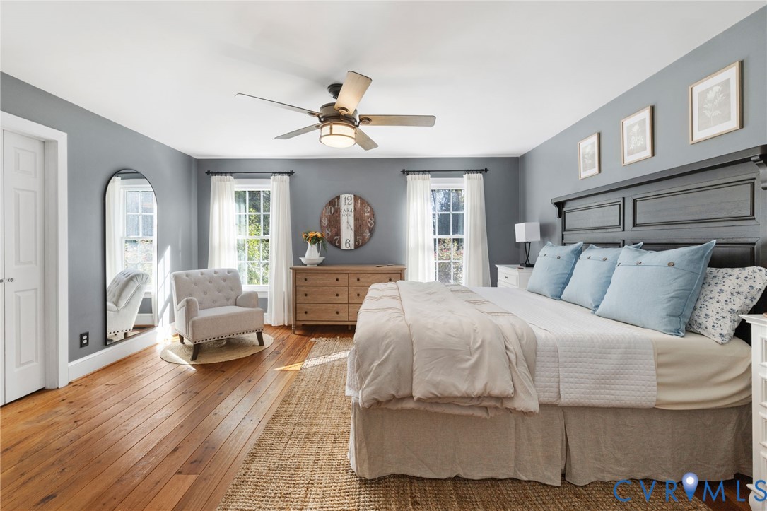 6256 Old Buckingham Road Powhatan, VA 23139 - Photo 21 of 48 a bedroom with a bed and wooden floor