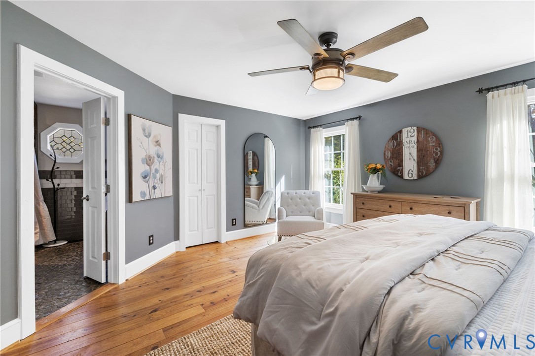 6256 Old Buckingham Road Powhatan, VA 23139 - Photo 22 of 48 a bedroom with a large bed and a chandelier