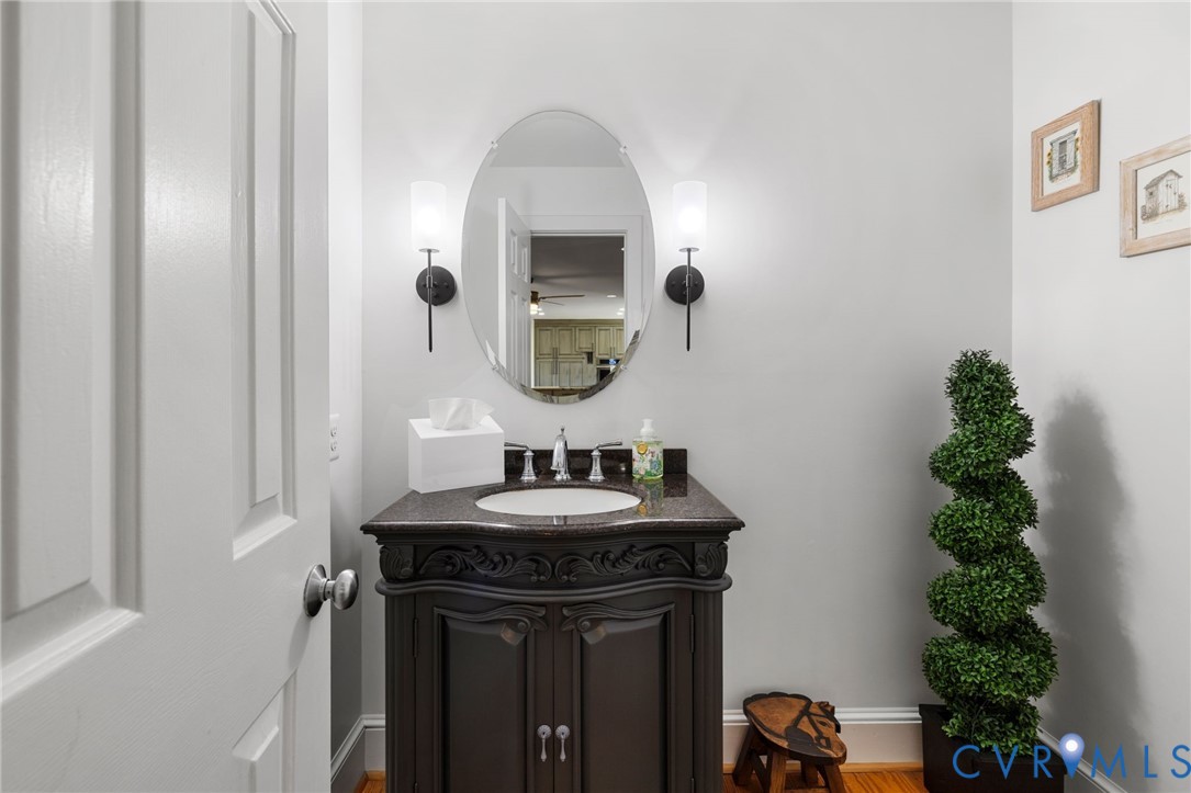 6256 Old Buckingham Road Powhatan, VA 23139 - Photo 26 of 48 a bathroom with a sink and a mirror