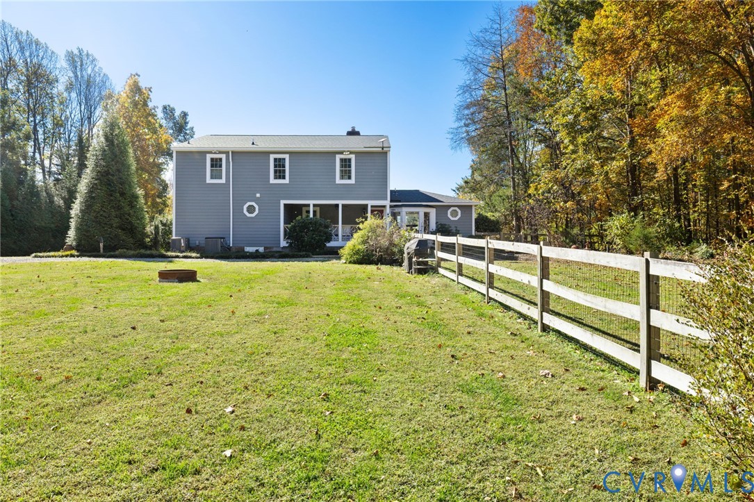 6256 Old Buckingham Road Powhatan, VA 23139 - Photo 40 of 48 a view of an house with backyard and trees