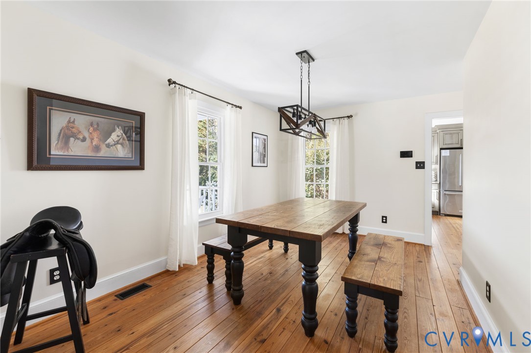 6256 Old Buckingham Road Powhatan, VA 23139 - Photo 8 of 48 a view of a workspace with furniture and wooden floor
