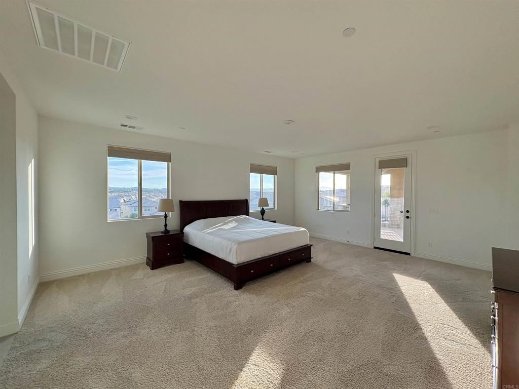 39529 Dayspring Way Temecula, CA 92591 - Photo 26 of 49 a bedroom with a bed and window