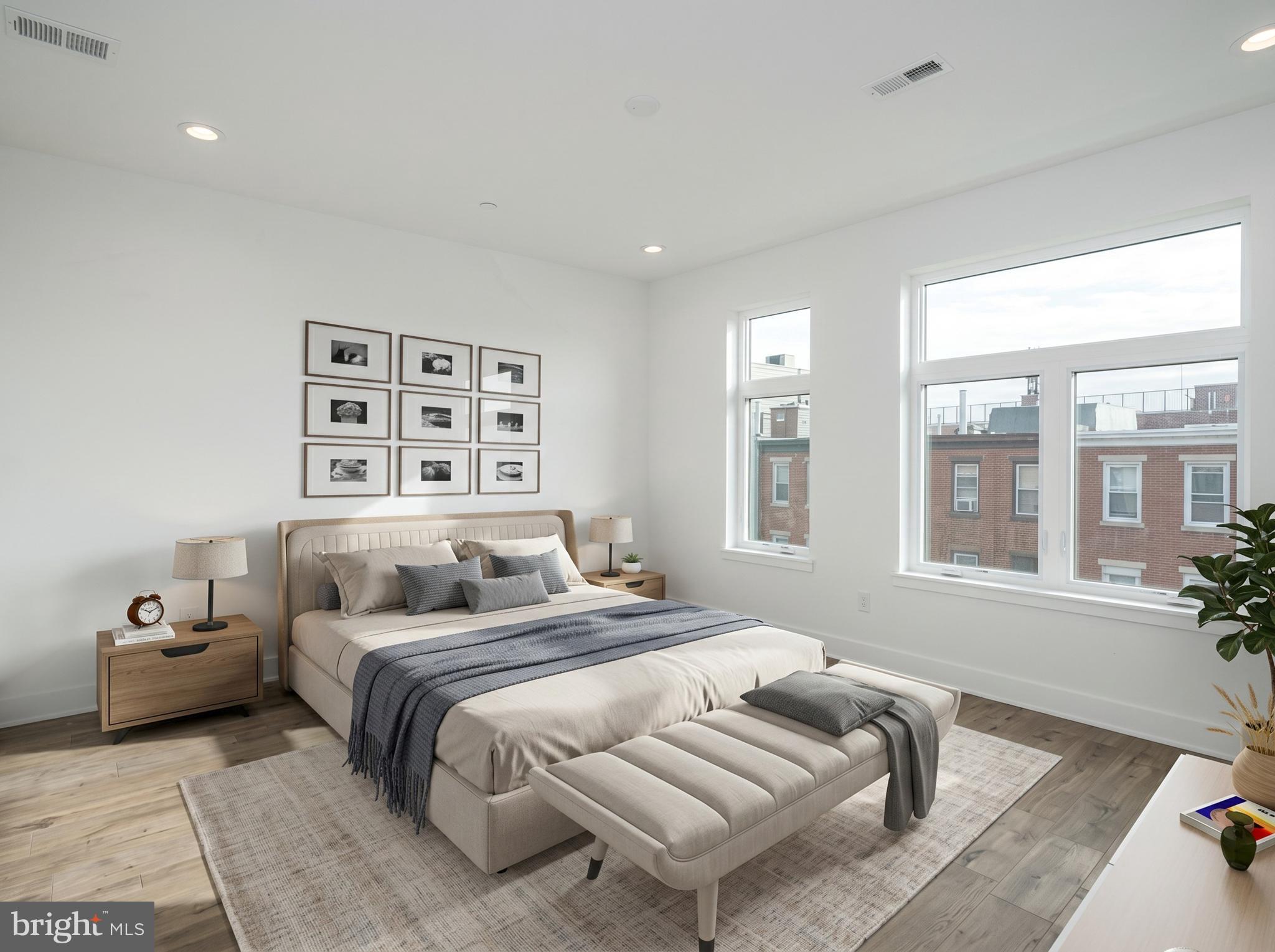 2827 Edgemont Street Philadelphia, PA 19134 - Photo 12 of 25 a bedroom with a bed and wooden floor
