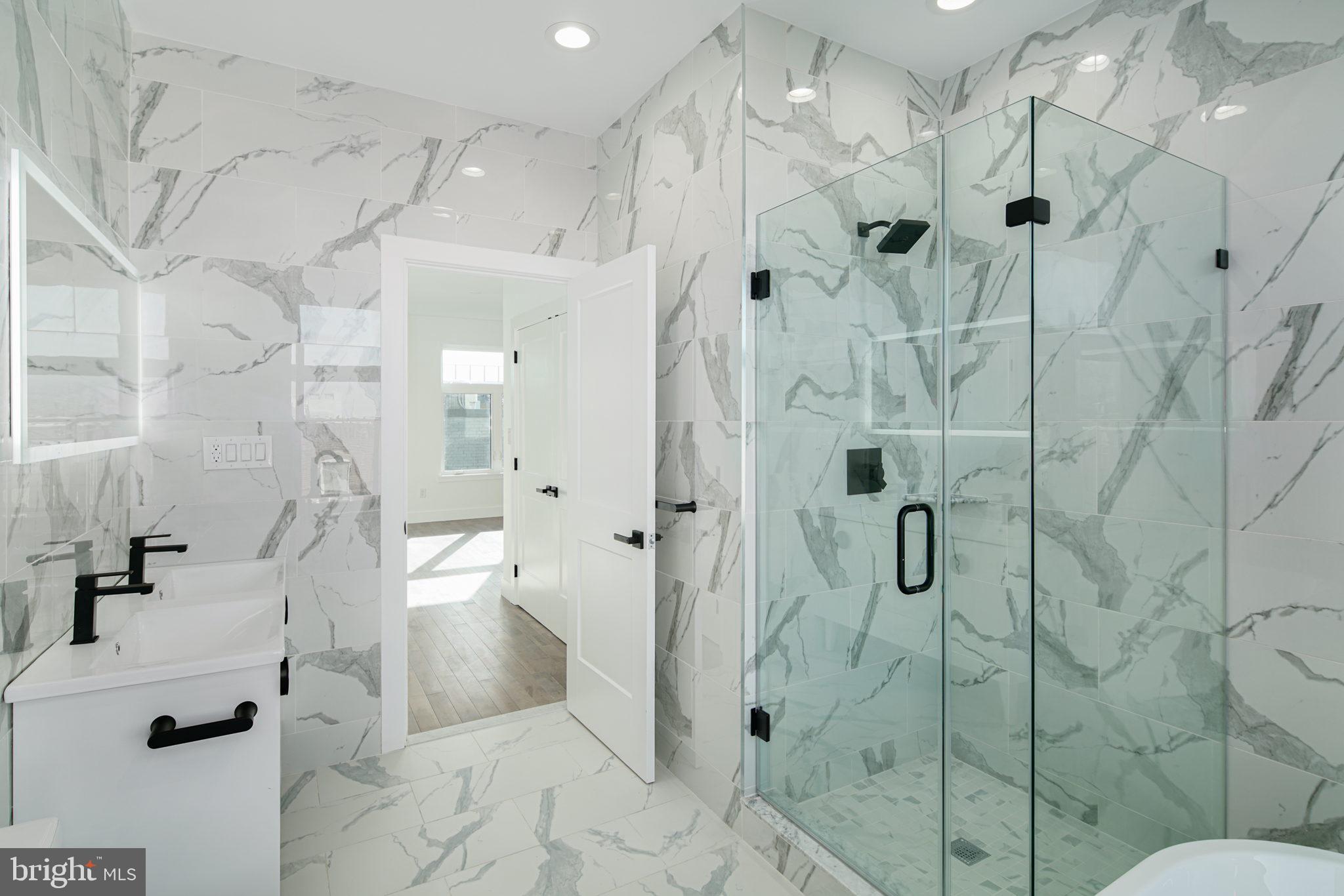2827 Edgemont Street Philadelphia, PA 19134 - Photo 15 of 25 a bathroom with a shower and a toilet