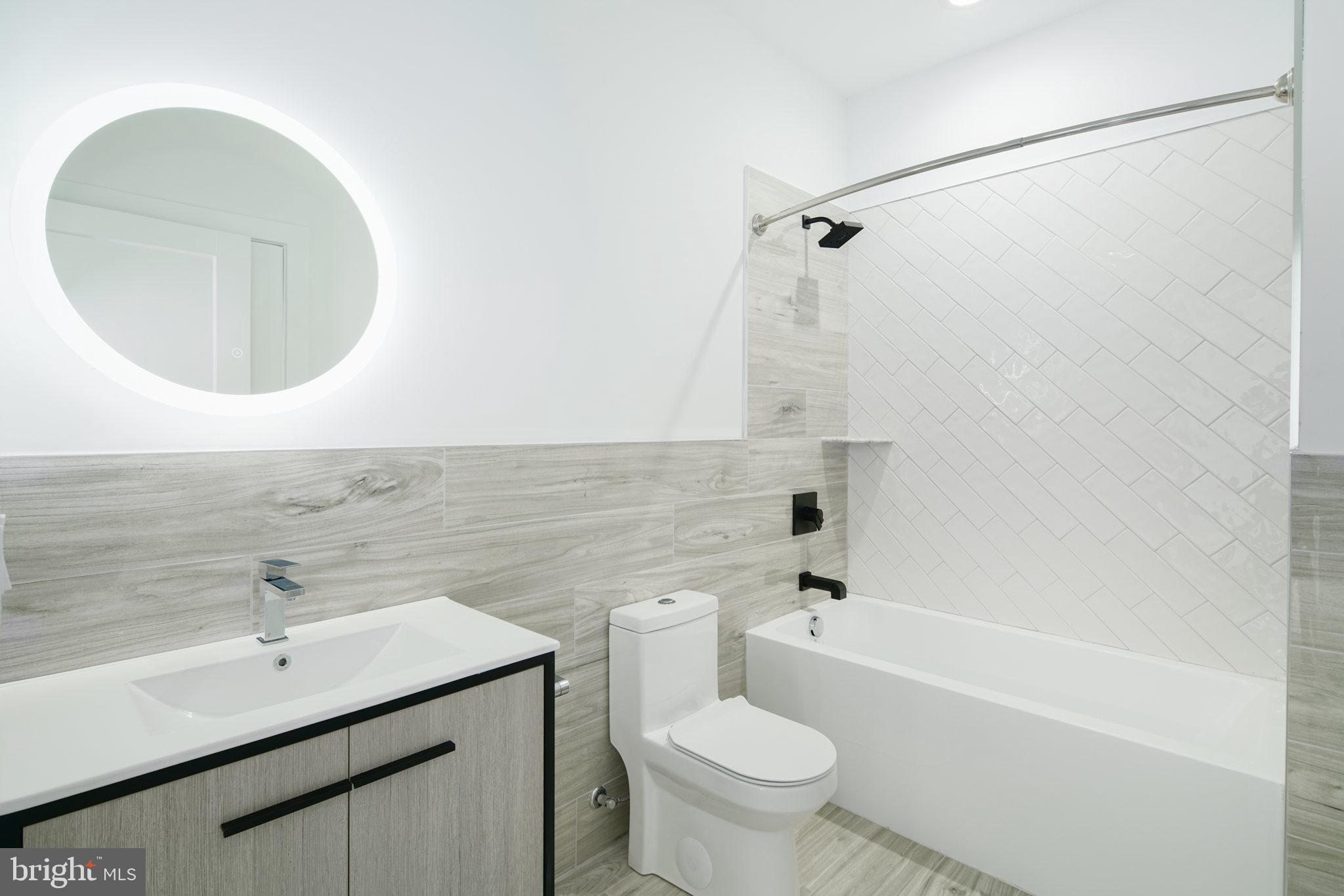 2827 Edgemont Street Philadelphia, PA 19134 - Photo 19 of 25 a bathroom with a sink toilet and shower