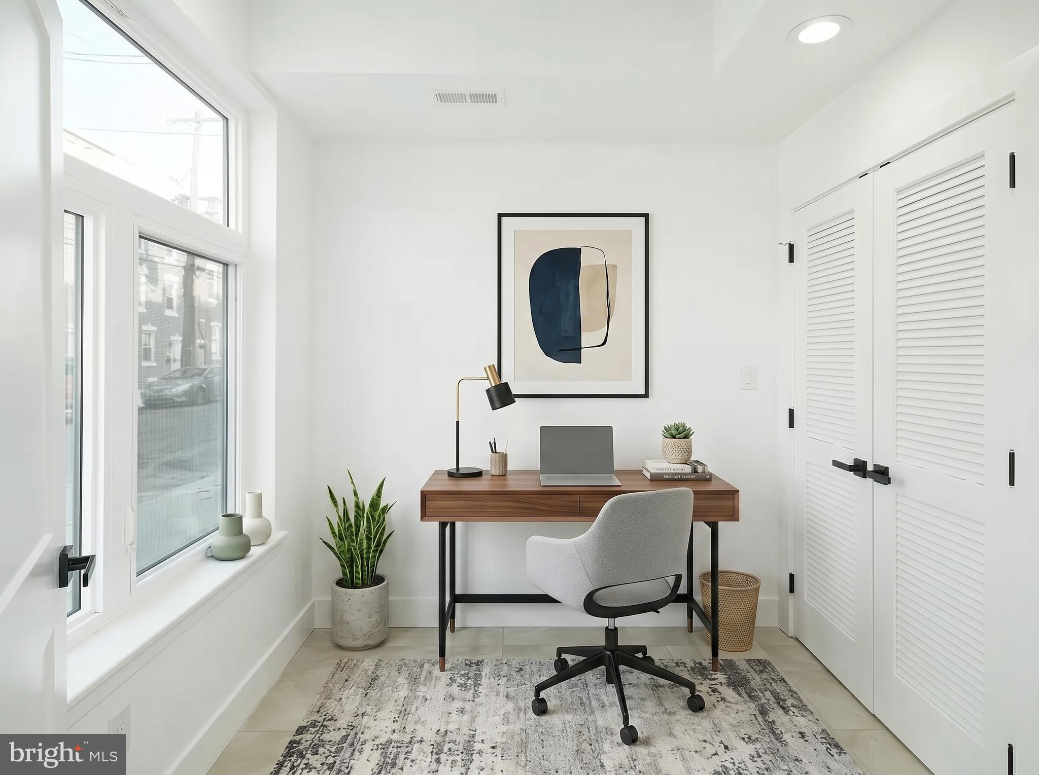 2827 Edgemont Street Philadelphia, PA 19134 - Photo 4 of 25 a workspace with furniture and a window