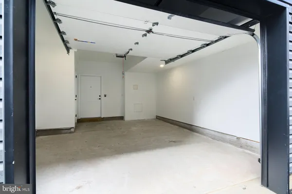 a view of a big room with a ceiling fan