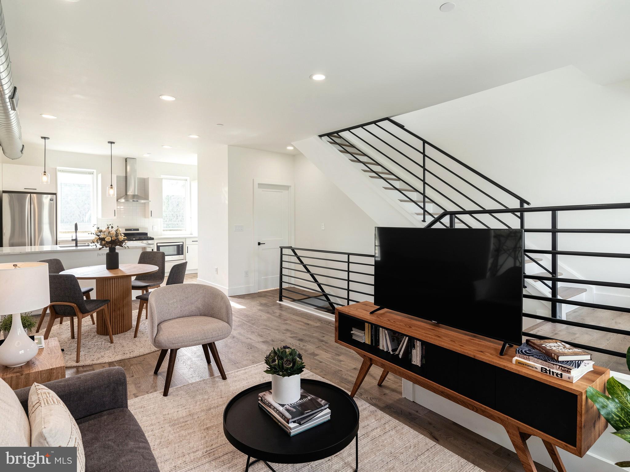 2827 Edgemont Street Philadelphia, PA 19134 - Photo 7 of 25 a living room with furniture and a flat screen tv