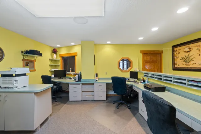 a view of a workspace with furniture