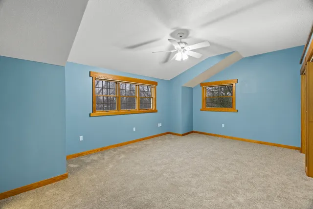 a view of yard with tree in the background