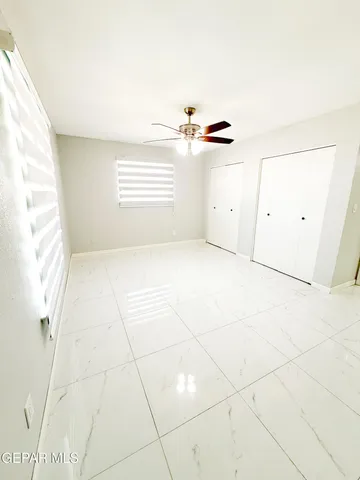 a bathroom with a double vanity sink toilet and shower