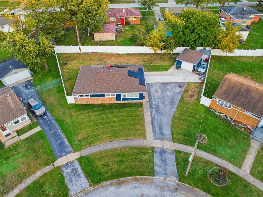 16047 Cambridge Court Markham, IL 60428 - Photo 22 of 34 an aerial view of a house with garden space sitting space and swimming pool