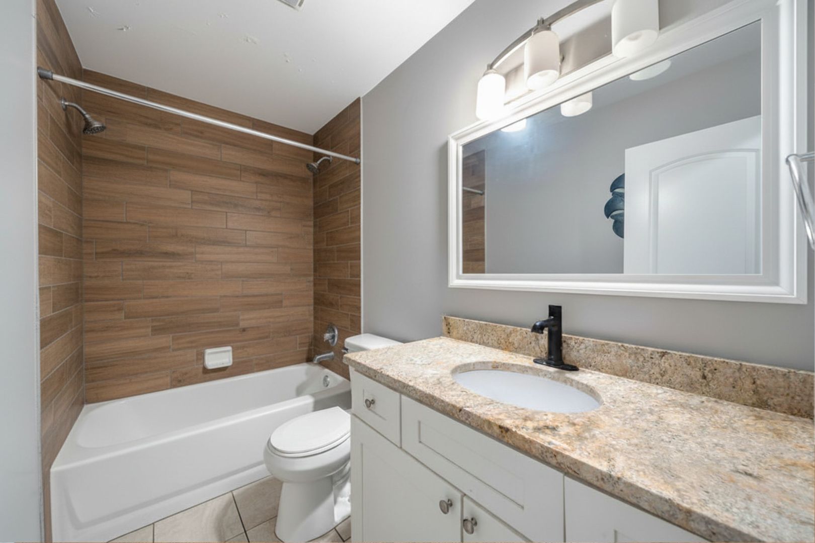 16047 Cambridge Court Markham, IL 60428 - Photo 34 of 34 a bathroom with a granite countertop sink toilet and shower