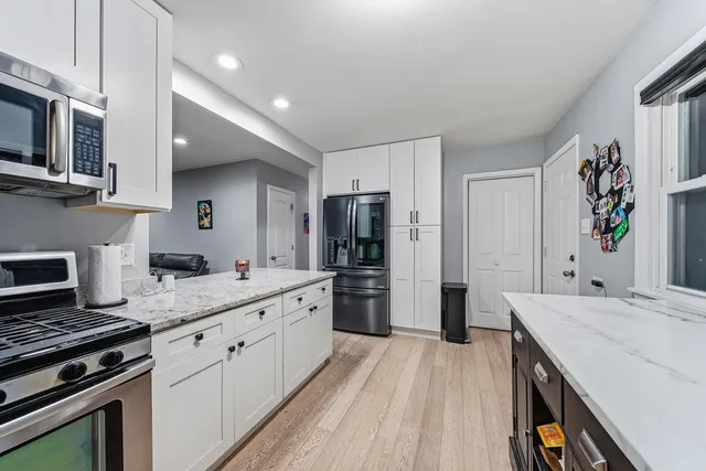 a kitchen with a sink stove and refrigerator