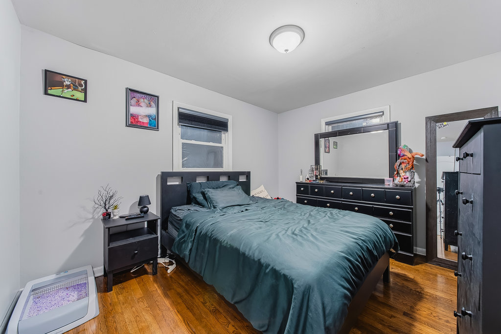 16047 Cambridge Court Markham, IL 60428 - Photo 8 of 34 a bedroom with a bed and a flat screen tv