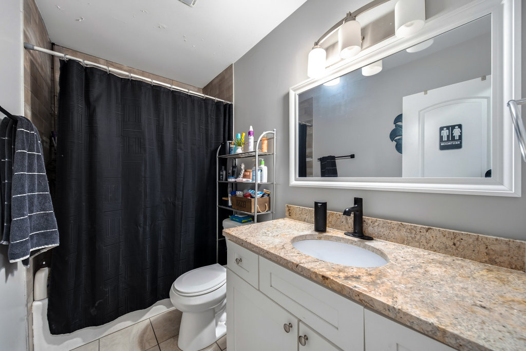 16047 Cambridge Court Markham, IL 60428 - Photo 9 of 34 a bathroom with a granite countertop sink toilet and shower