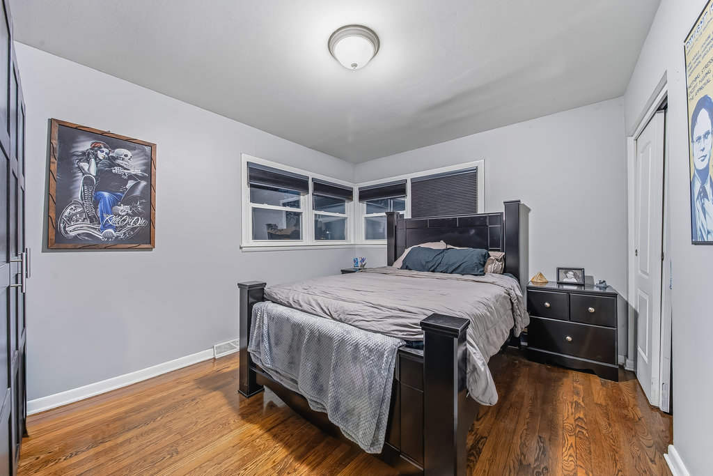 16047 Cambridge Court Markham, IL 60428 - Photo 10 of 34 a bedroom with a bed and wooden floor