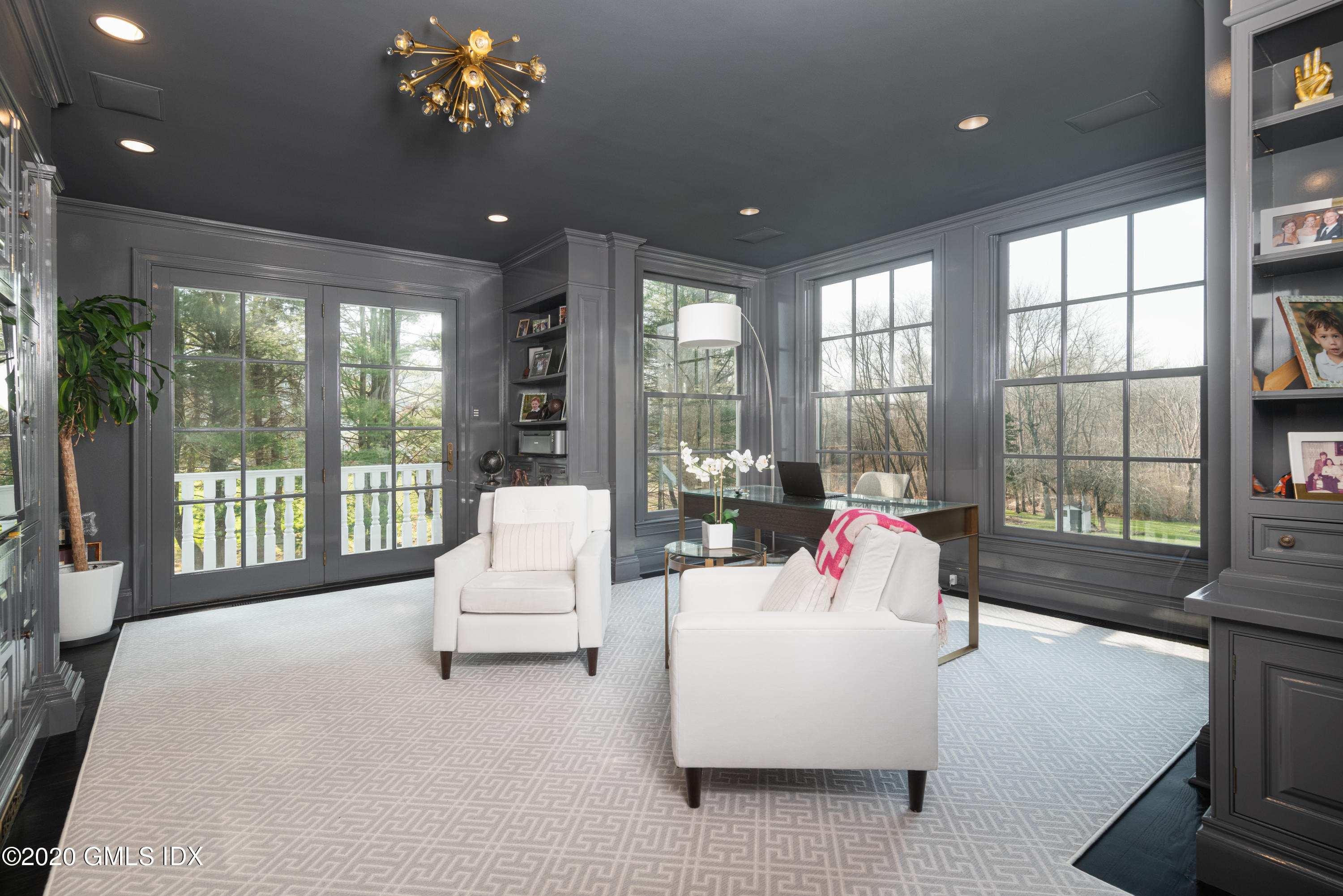 390 Round Hill Road Greenwich, CT 06831 - Photo 11 of 31 a living room with furniture and a large window