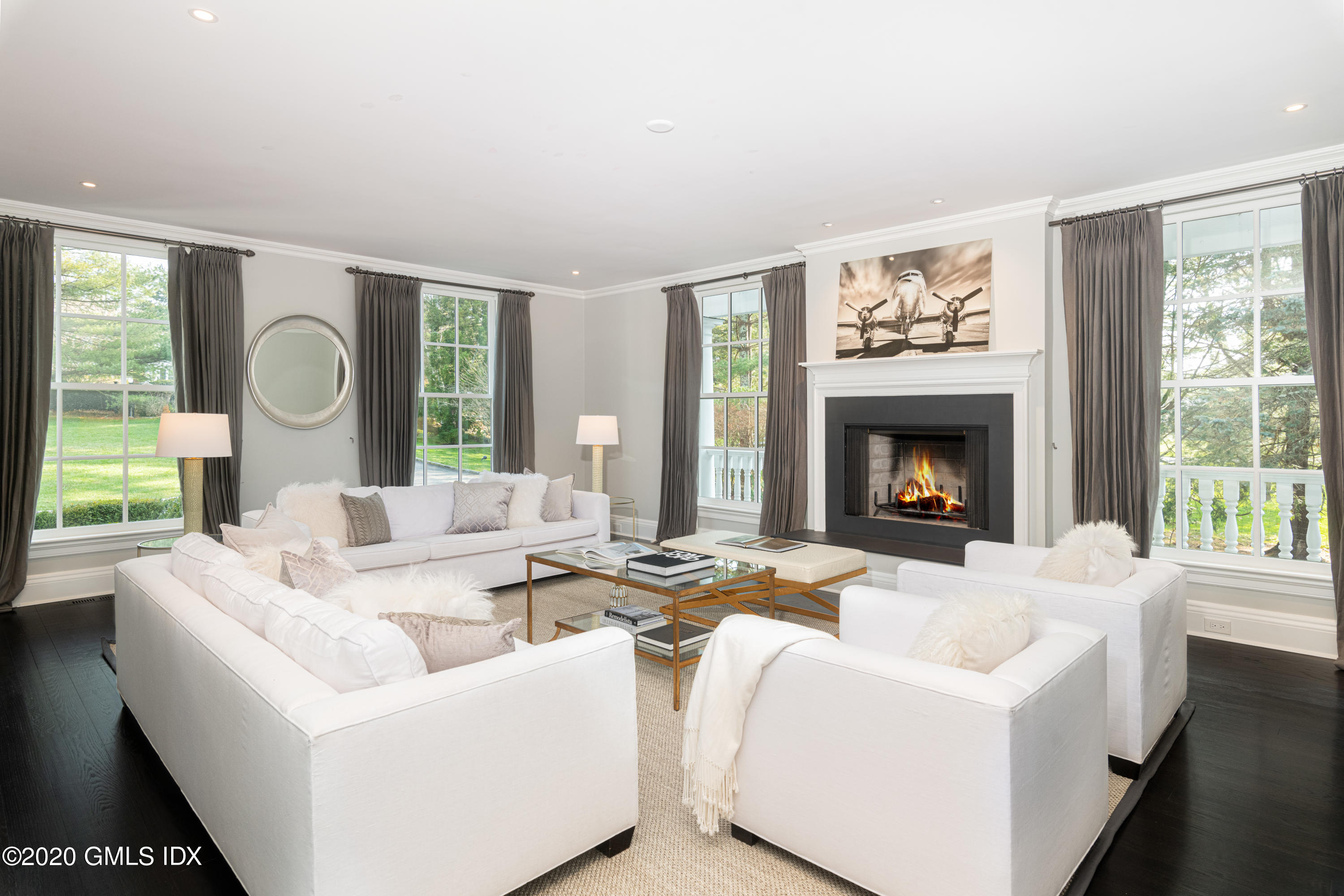390 Round Hill Road Greenwich, CT 06831 - Photo 12 of 31 a living room with furniture and a fireplace
