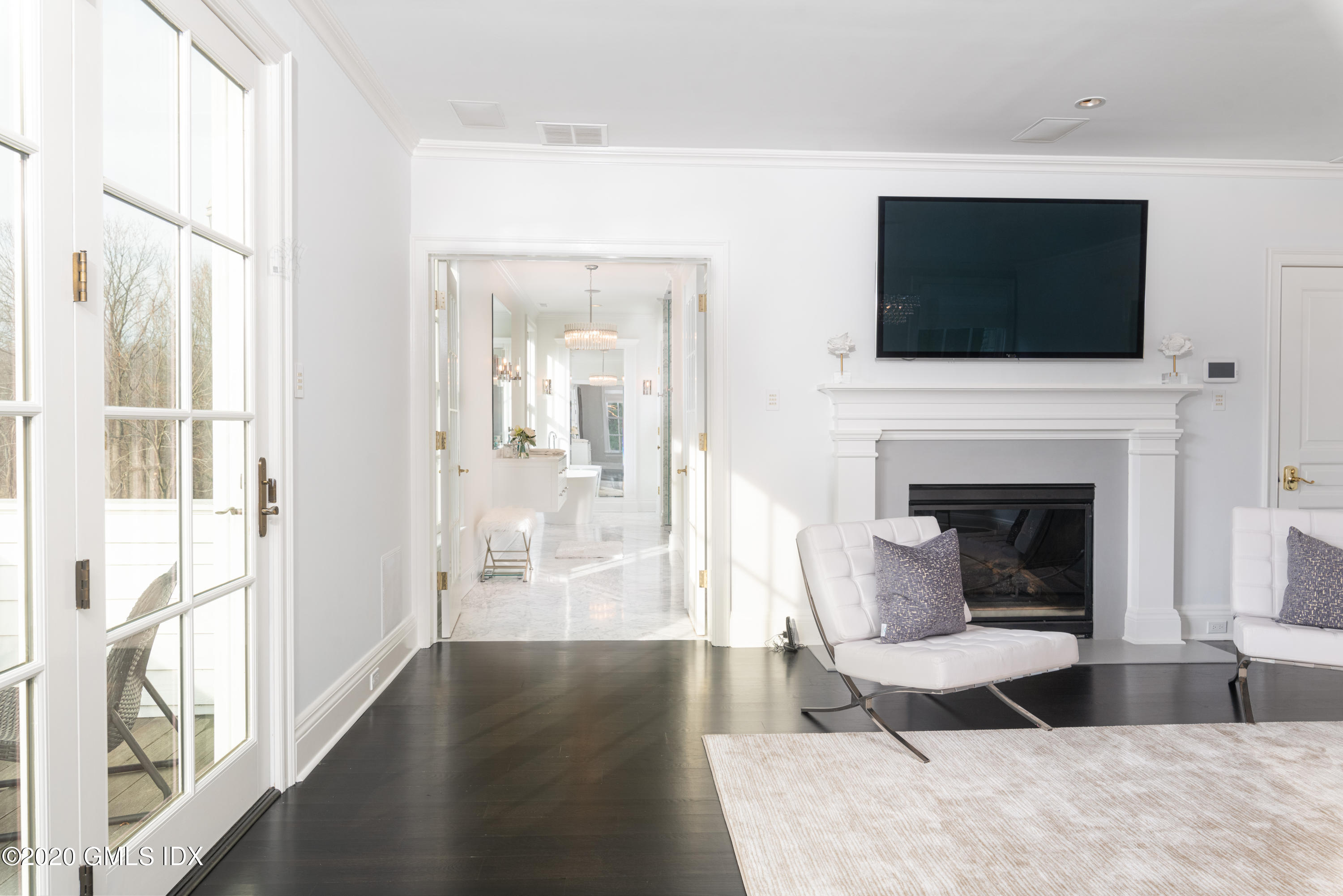 390 Round Hill Road Greenwich, CT 06831 - Photo 16 of 31 a living room with furniture and a fireplace