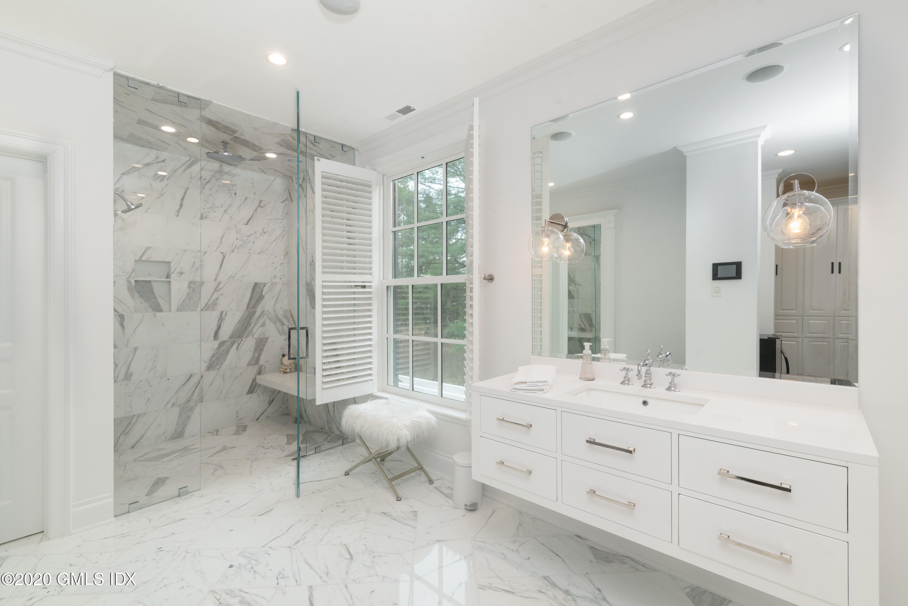 390 Round Hill Road Greenwich, CT 06831 - Photo 18 of 31 a bathroom with a double vanity sink mirror and shower