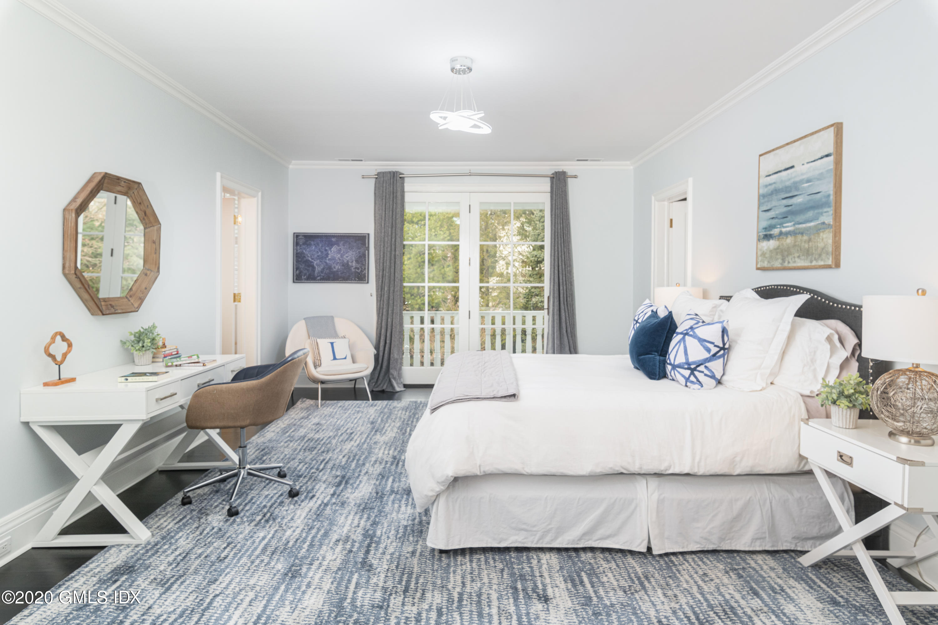 390 Round Hill Road Greenwich, CT 06831 - Photo 22 of 31 a living room with furniture a table and a large window