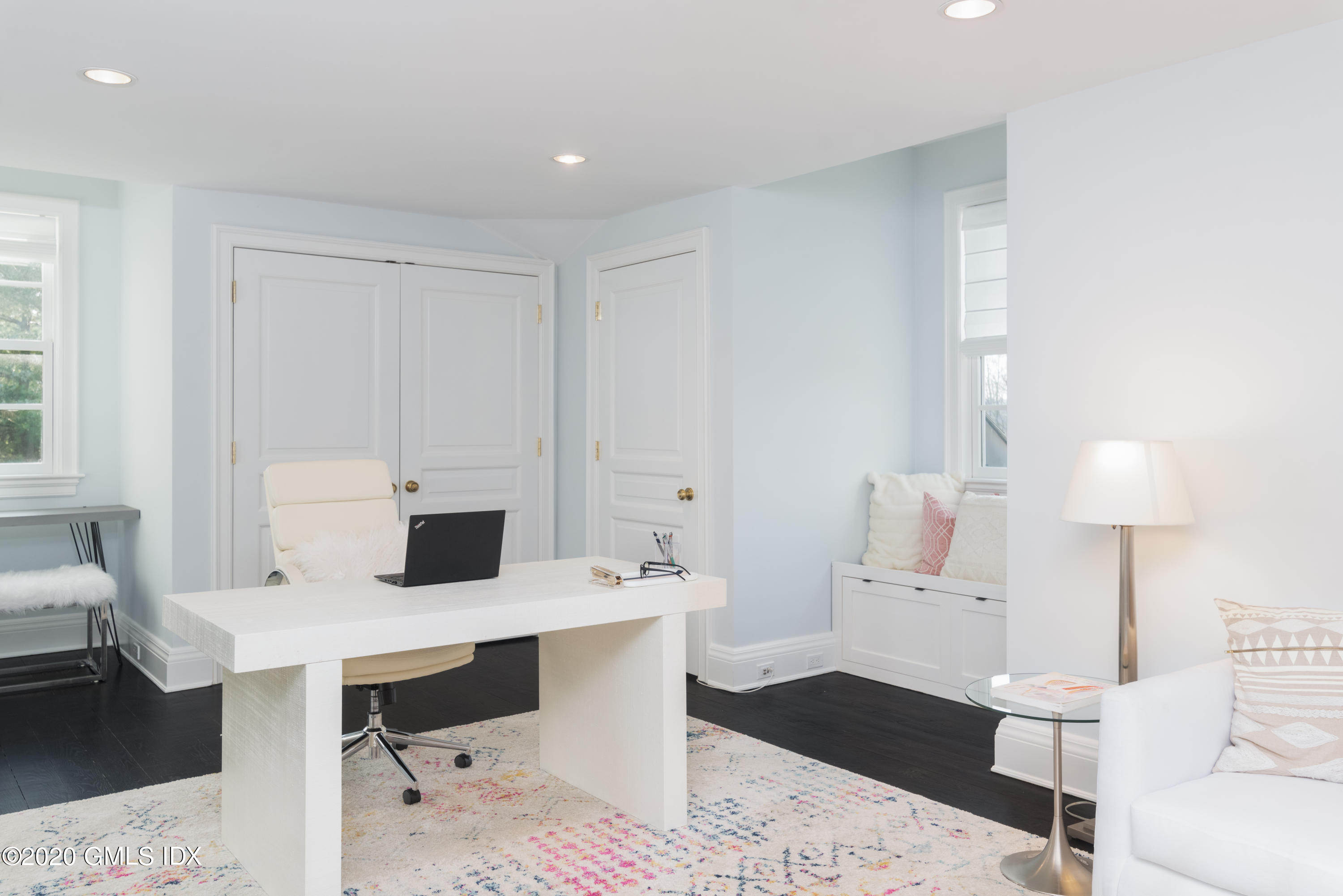 390 Round Hill Road Greenwich, CT 06831 - Photo 23 of 31 a living room with furniture and a table