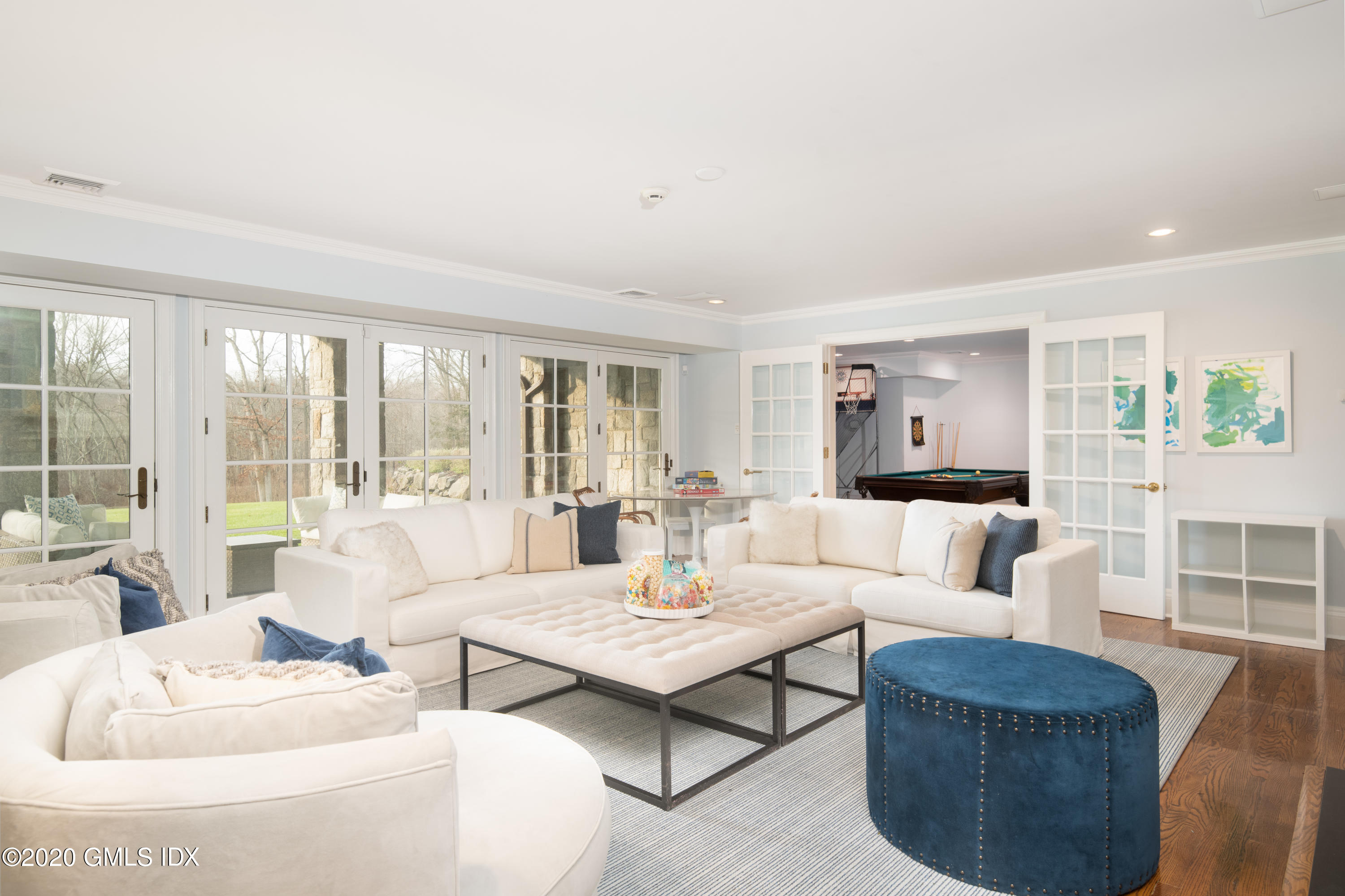 390 Round Hill Road Greenwich, CT 06831 - Photo 26 of 31 a living room with furniture and a large window