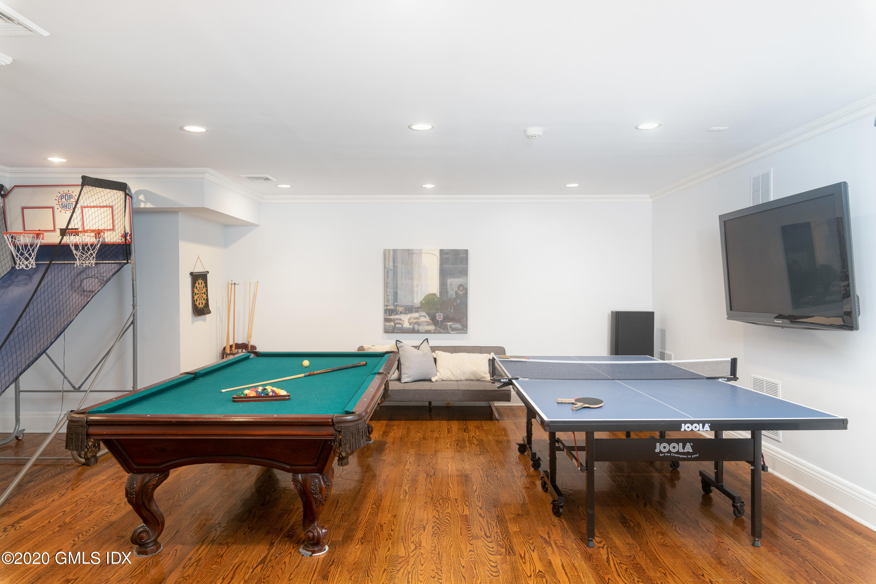 390 Round Hill Road Greenwich, CT 06831 - Photo 28 of 31 a room with furniture and a flat screen tv