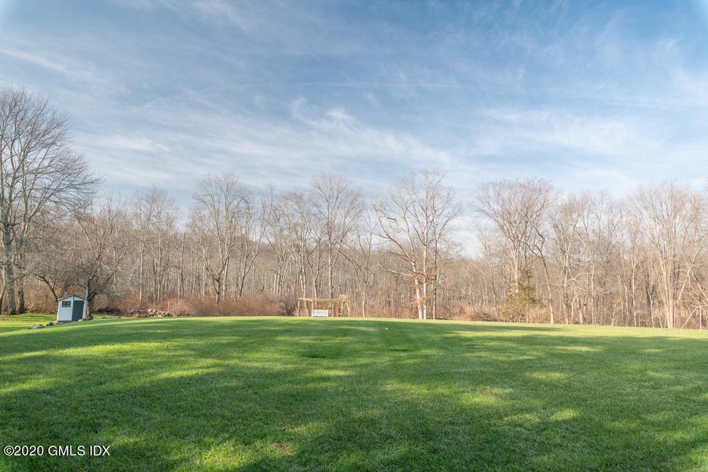 390 Round Hill Road Greenwich, CT 06831 - Photo 31 of 31 a view of yard with large trees