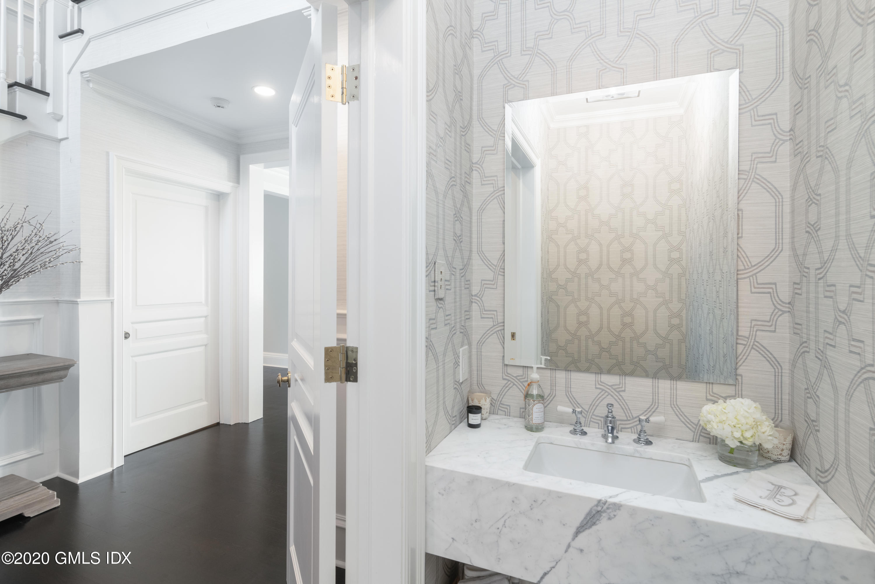 390 Round Hill Road Greenwich, CT 06831 - Photo 4 of 31 a bathroom with a sink and a mirror