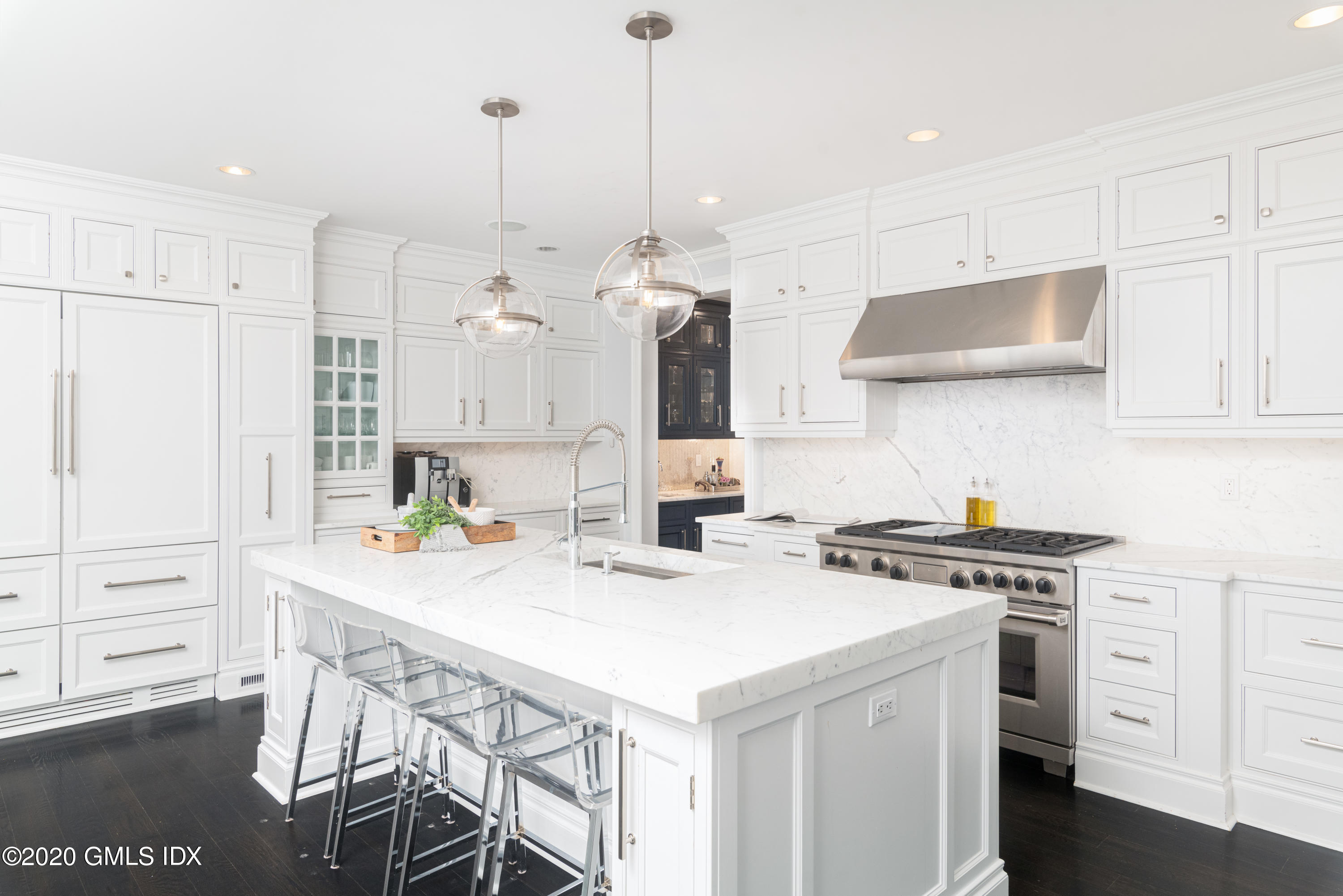 390 Round Hill Road Greenwich, CT 06831 - Photo 7 of 31 a kitchen that has a cabinets a stove a sink and a refrigerator