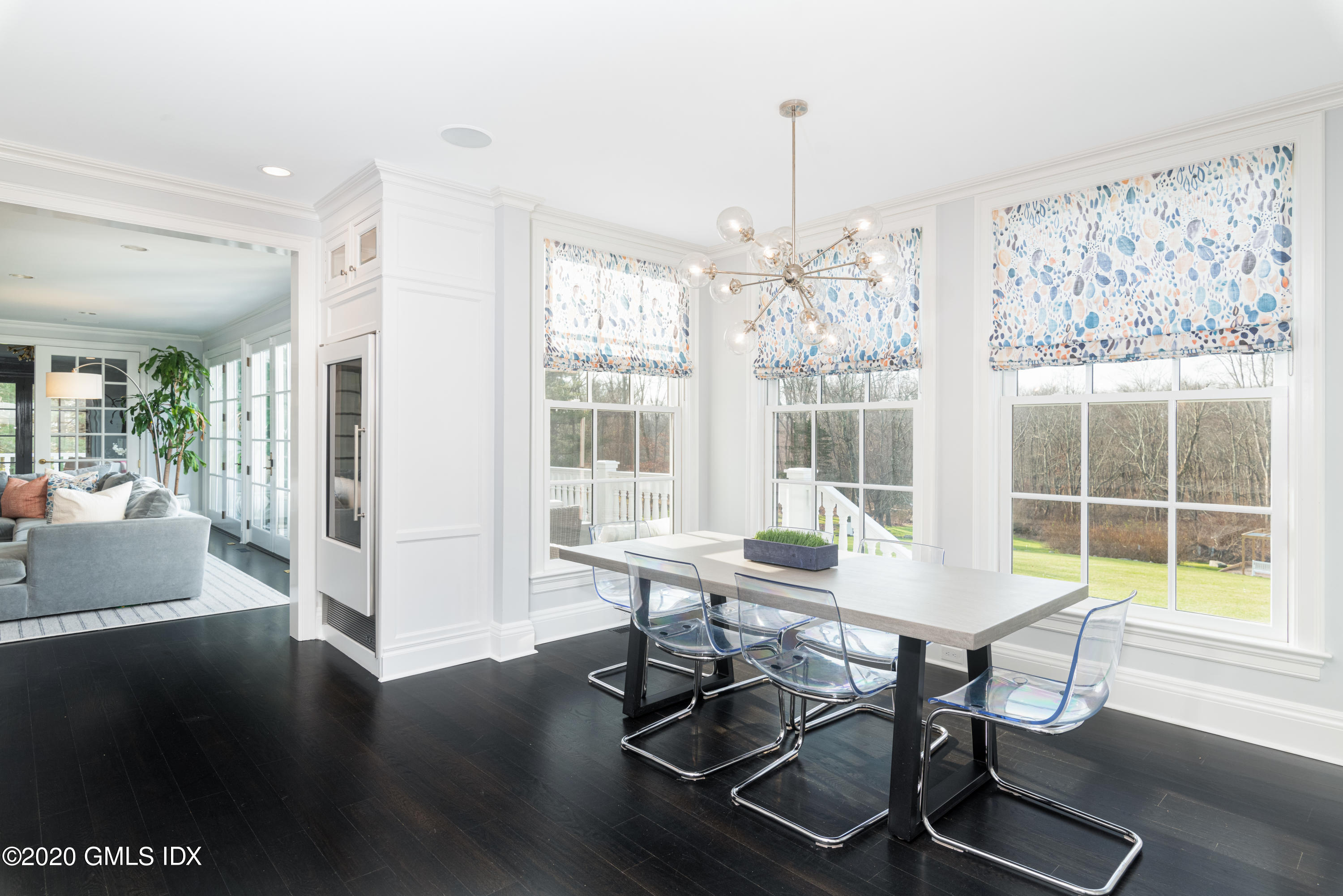 390 Round Hill Road Greenwich, CT 06831 - Photo 8 of 31 a view of a dining room with furniture wooden floor and a chandelier