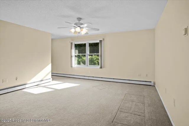 a bathroom with a toilet a sink and a window