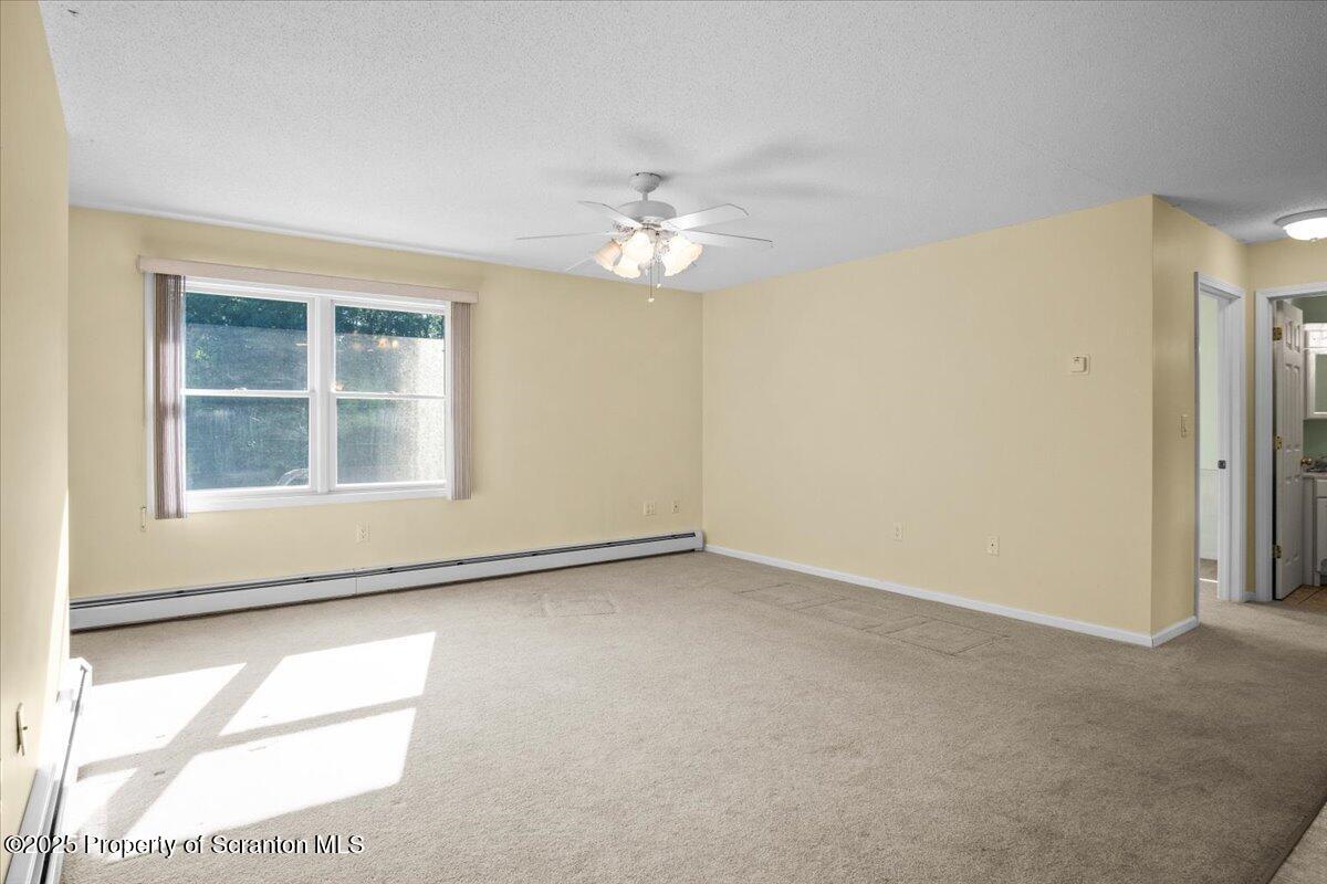 4089 State Rte 2073 Susquehanna, PA 18847 - Photo 23 of 63 an empty room with windows and fan