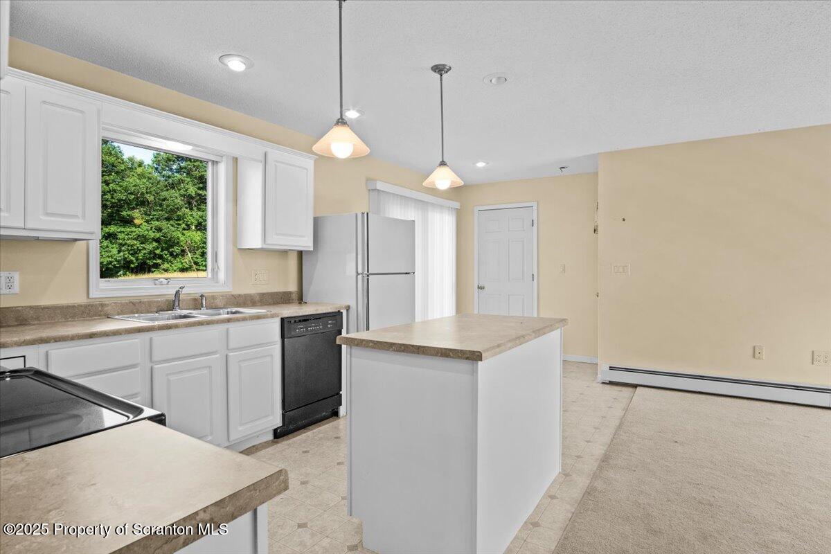 4089 State Rte 2073 Susquehanna, PA 18847 - Photo 26 of 63 a large kitchen with granite countertop a sink a counter space appliances and cabinets