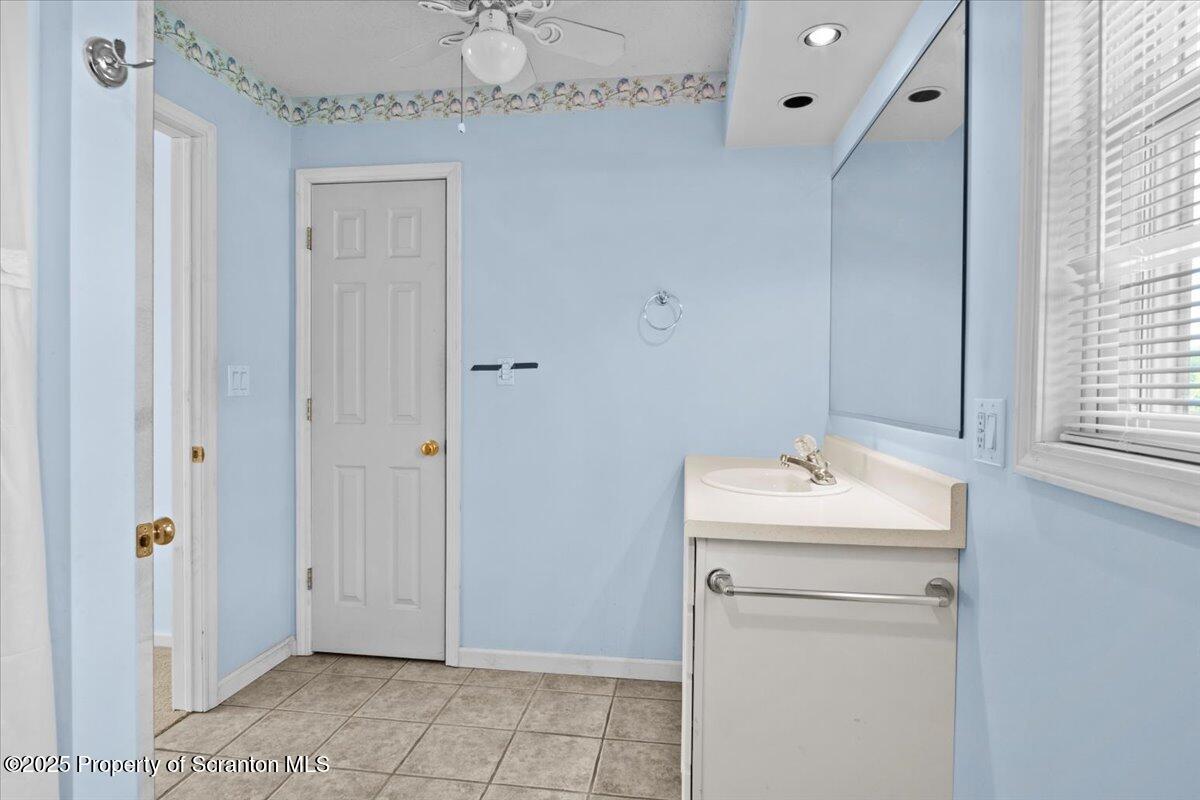 4089 State Rte 2073 Susquehanna, PA 18847 - Photo 31 of 63 a bathroom with a sink and a mirror