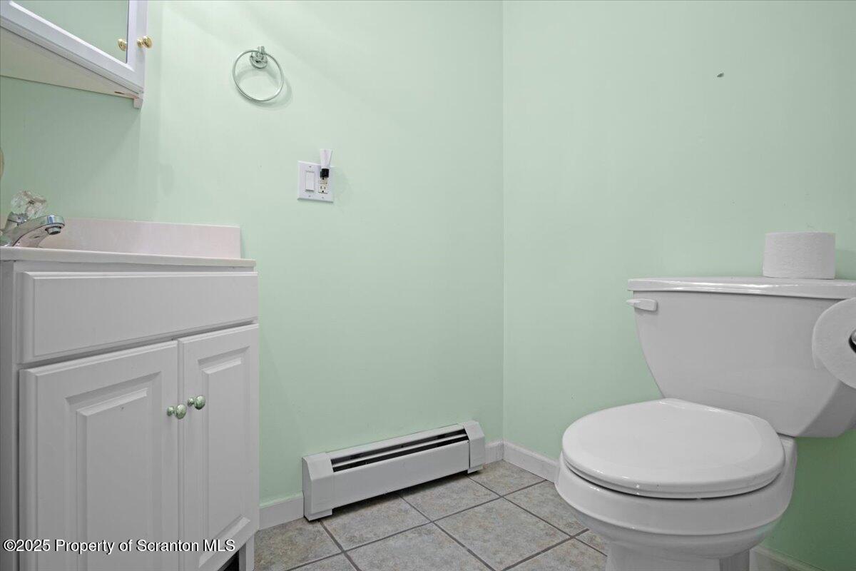 4089 State Rte 2073 Susquehanna, PA 18847 - Photo 34 of 63 a white toilet sitting next to a bathroom sink