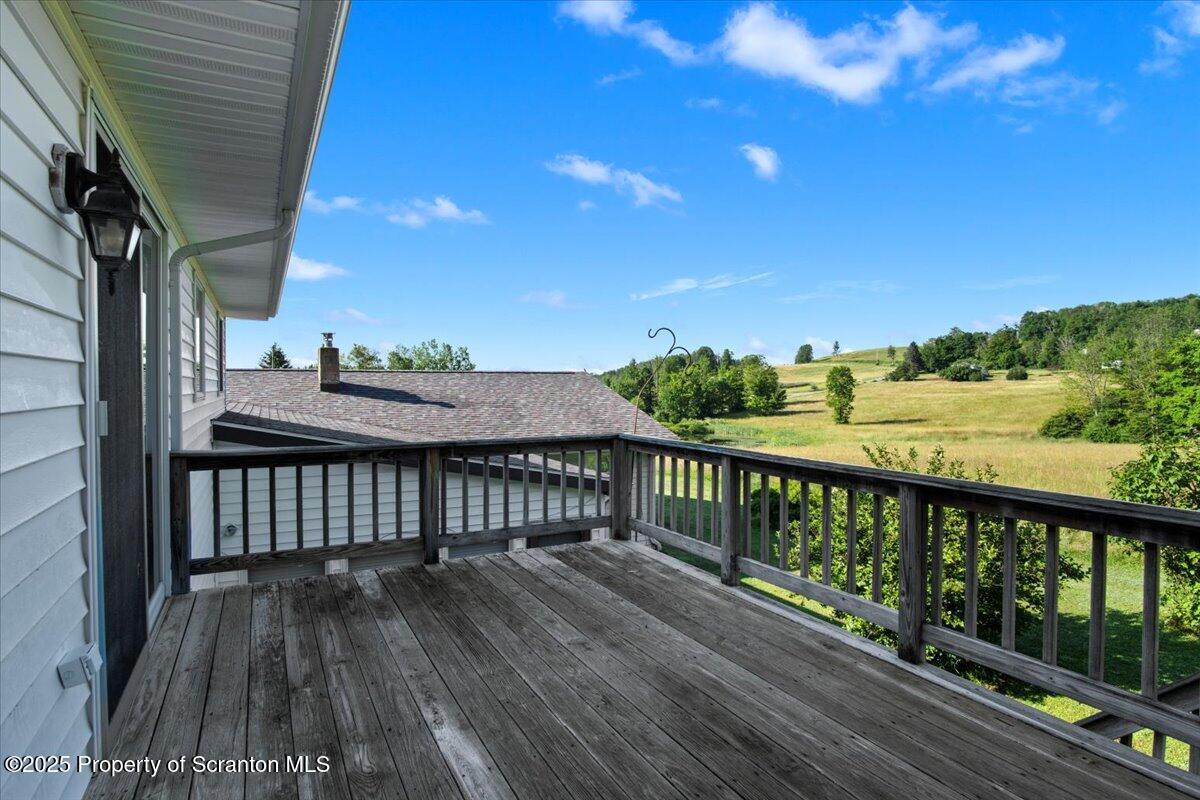 4089 State Rte 2073 Susquehanna, PA 18847 - Photo 35 of 63 a view of balcony with wooden floor and fence