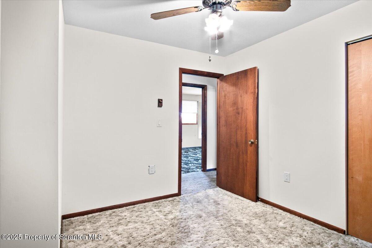 4089 State Rte 2073 Susquehanna, PA 18847 - Photo 53 of 63 a view of a hallway with a chandelier fan