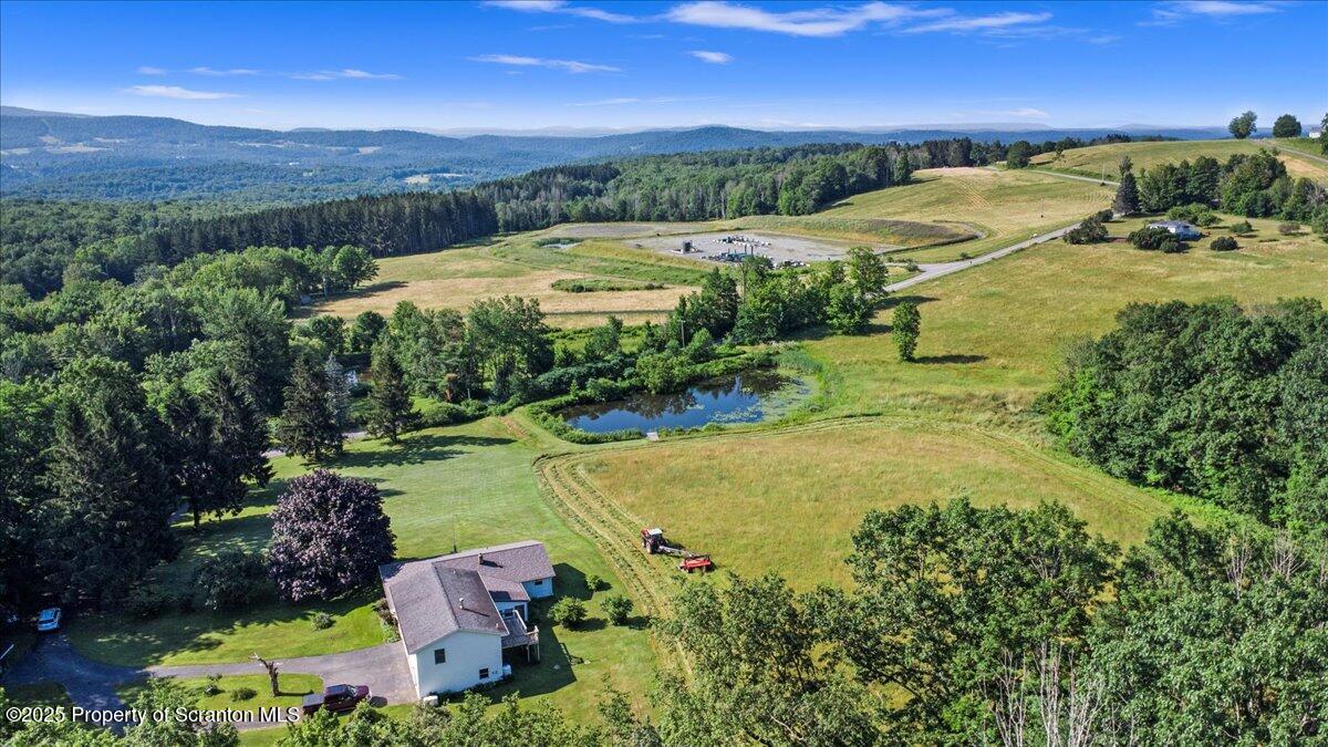 4089 State Rte 2073 Susquehanna, PA 18847 - Photo 7 of 63 an aerial view of residential houses with outdoor space and trees all around