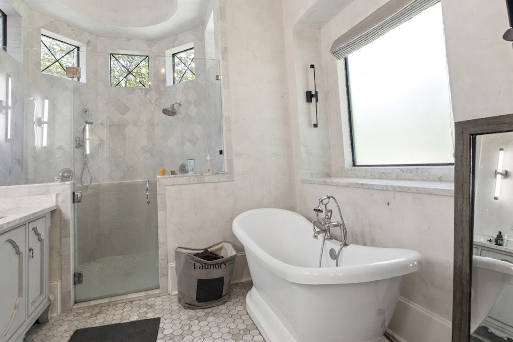 3818 Waterbend Cove Spring, TX 77386 - Photo 16 of 44 a bathroom with a sink toilet and shower