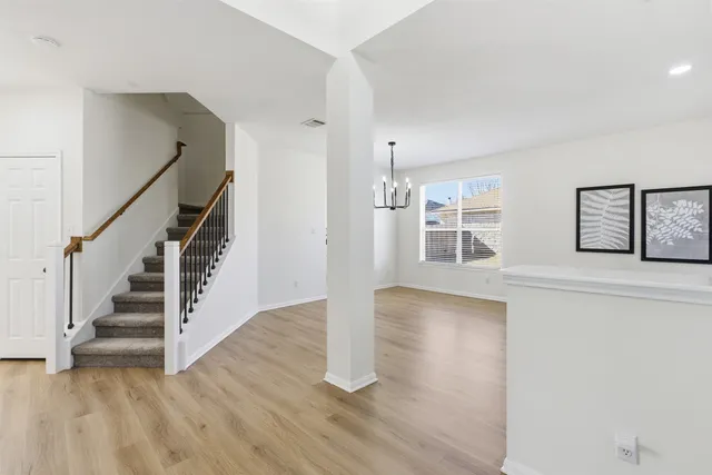 a view of swimming pool with outdoor seating and plants