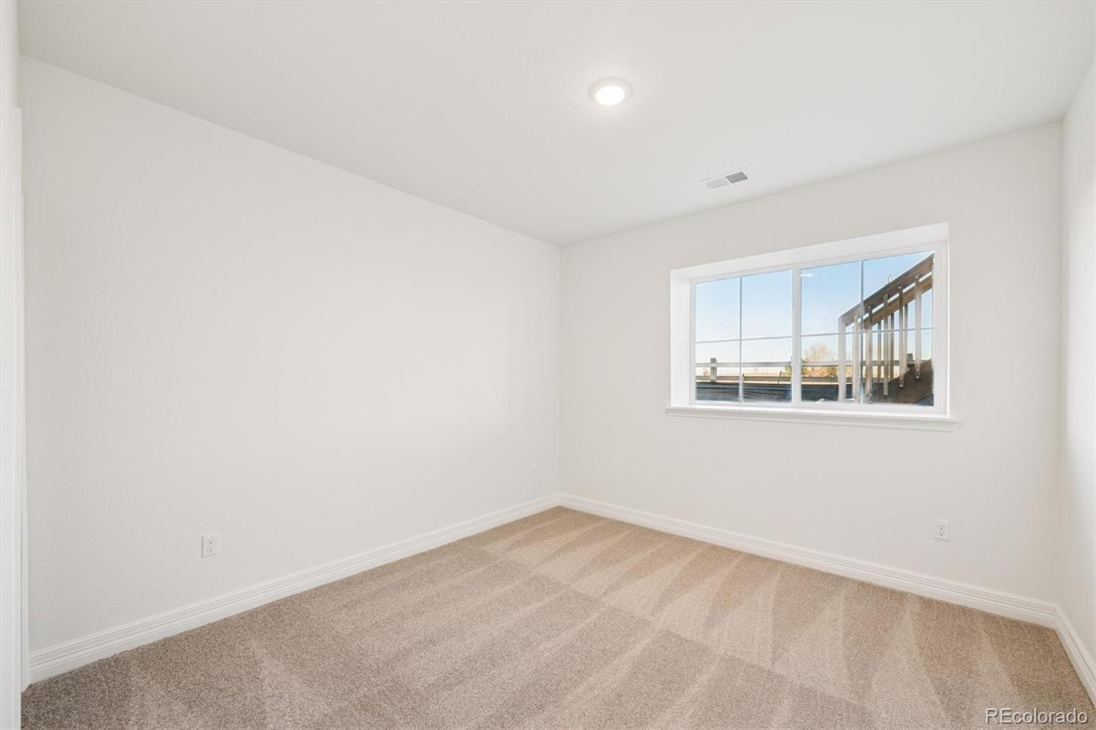 1168 Weller Street Timnath, CO 80547 - Photo 20 of 24 an empty room with a window