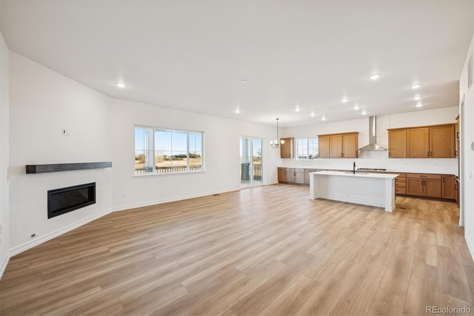 1168 Weller Street Timnath, CO 80547 - Photo 10 of 24 a view of kitchen with wooden floor and electronic appliances