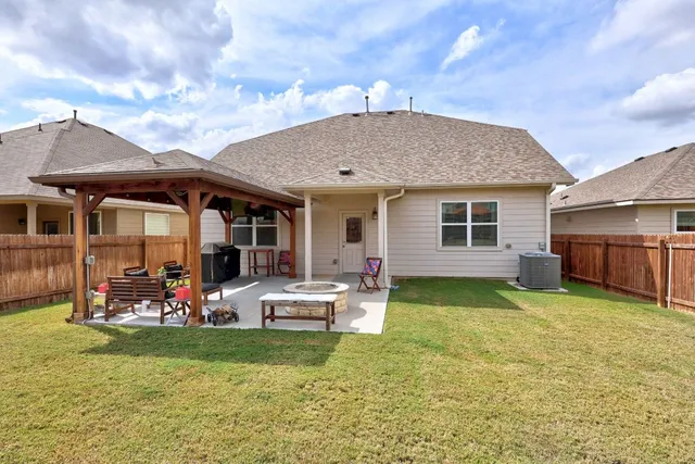 a view of a house with a yard porch and sitting area