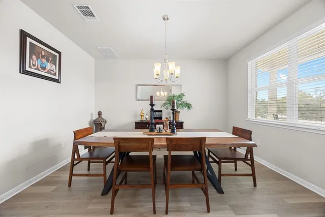 a view of a dining room with furniture window and outside view