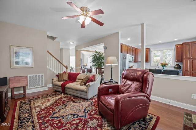 a living room with furniture flower pot and a fireplace