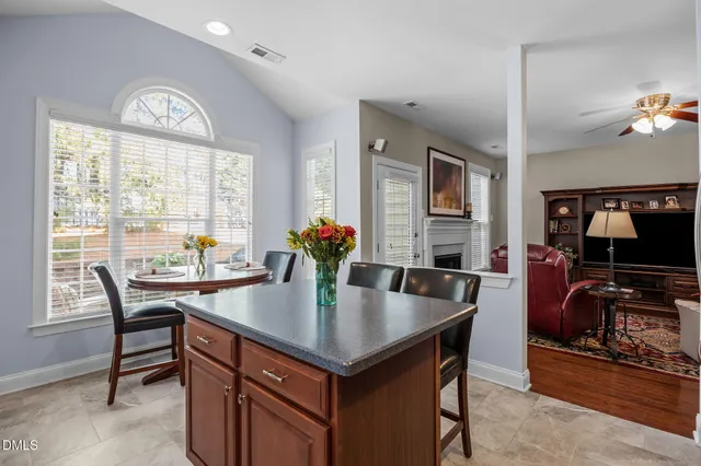 a living room with furniture ceiling fan and a rug